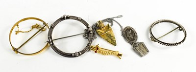 Lot 192 - A silver coin mount brooch, an arrow head...