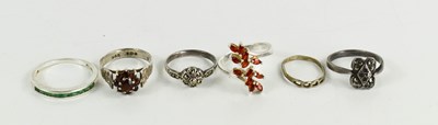 Lot 171 - A silver and garnet flower head ring, a silver...