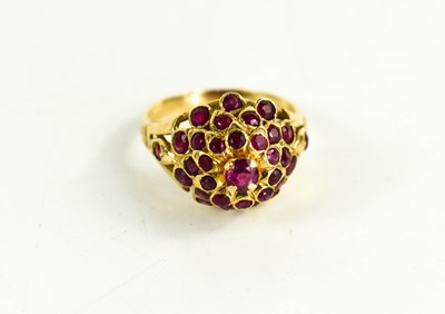 Lot 85 - A 14ct gold and pink sapphire cluster / flower...