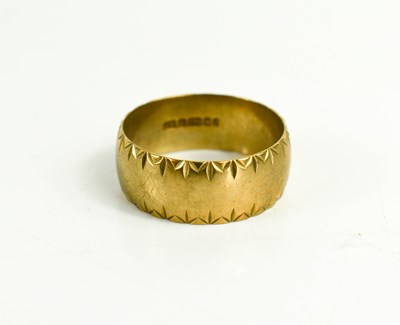 Lot 26 - A 9ct gold wedding band, with engraved...