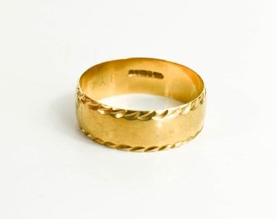 Lot 24 - A 9ct gold wedding band with rope twist...