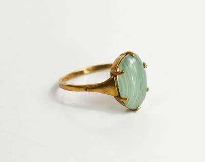 Lot 200 - A 9ct gold and jade dress ring, set with pale...