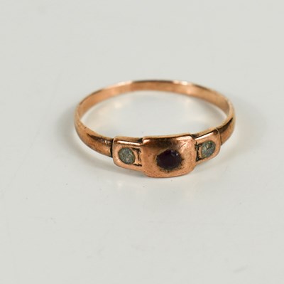 Lot 173 - A rose gold (testing as 9ct) and garnet ring,...