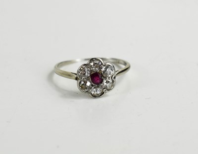 Lot 142 - An Art Deco ruby and diamond flowerhead ring,...