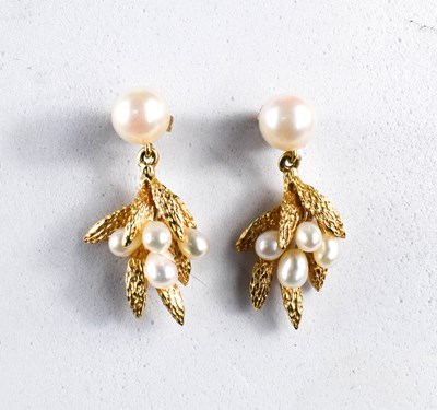 Lot 50 - A pair of 14ct gold and pearl drop earrings in...