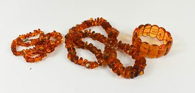 Lot 243 - Two amber necklaces; one composed of rough cut...