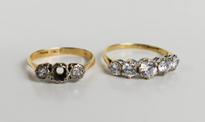 Lot 216 - A 9ct gold and cubic zircona five stone ring,...