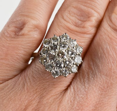 Lot 148 - A mid century diamond cluster dress ring, set...