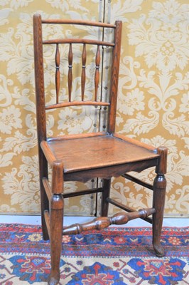 Lot 400 - A 19th century oak country spindle back chair,...