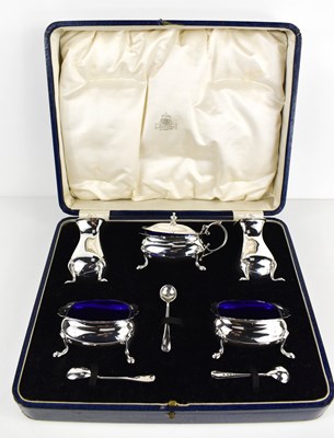 Lot 459 - An Art Deco cruet set comprising salt, pepper...