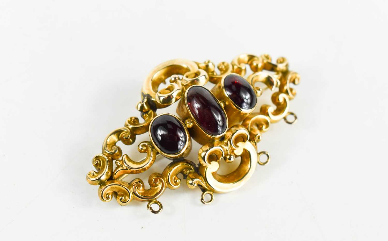 Lot 33 - A 19th century rolled gold and garnet three...