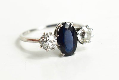 Lot 9 - A diamond and sapphire three stone ring, with...
