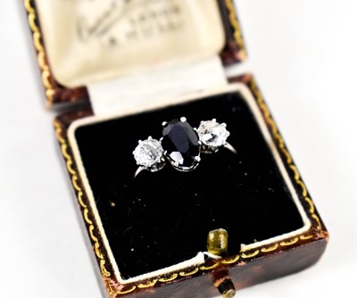 Lot 9 - A diamond and sapphire three stone ring, with...