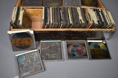 Lot 237 - A collection of eighty three glass slides,...