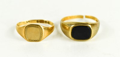 Lot 239 - Two 9ct gold signet rings, one set with black...