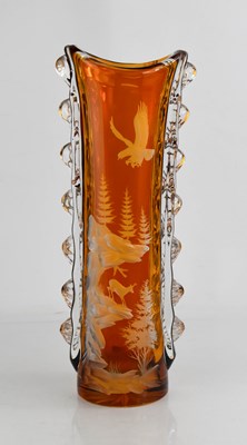 Lot 104 - A tall amber and transluscent cut glass vase,...