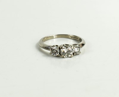 Lot 151 - An 18ct white gold three stone ring, the...