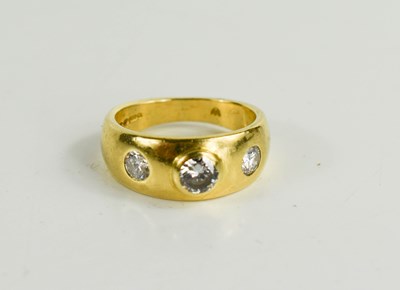 Lot 146 - An 18ct gold dress ring set with three...
