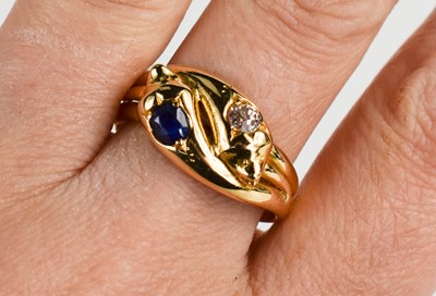 Lot 12 - An 18ct gold, sapphire and diamond snake ring,...
