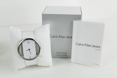 Lot 365 - A Calvin Klein wristwatch with white strap,...