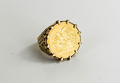 Lot 121 - A gold half sovereign set ring, dated 1898, 8.9g.