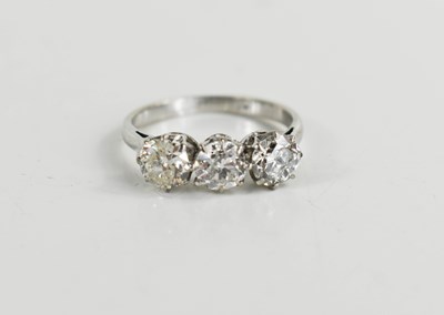 Lot 16 - A platinum and three stone diamond ring, the...