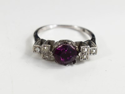 Lot 120 - An Art deco platinum, amethyst and diamond ring.