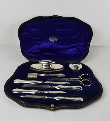 Lot 396 - A silver manicure set by Goldsmiths &...