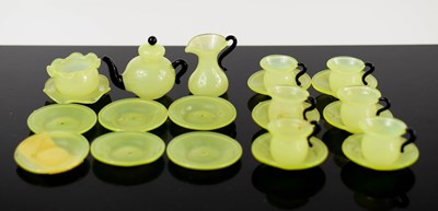 Lot 214 - A doll's house vaseline glass tea set with...