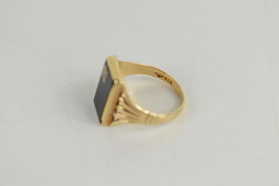 Lot 44 - A gentleman's 9ct gold, jet and diamond ring,...