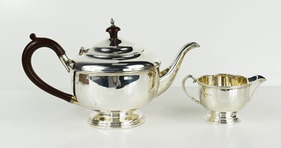 Lot 439 - A silver teapot with bakelite handle and knob...