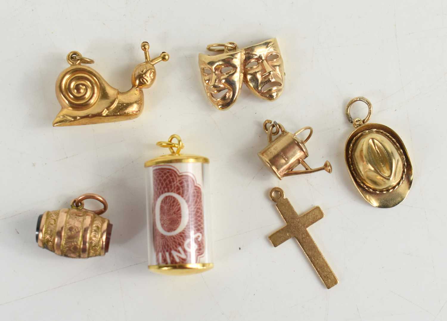 Lot 42 - A group of six 9ct gold charms, comprising a...
