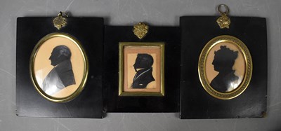 Lot 259 - Three Victorian silhouette portrait miniatures,...