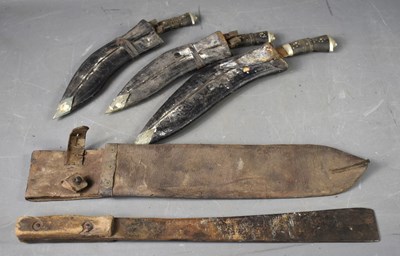 Lot 304 - A WWII machete and leather sheath, the sheath...