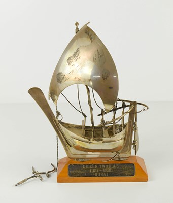 Lot 390 - A white metal trophy in the form of a sailing...