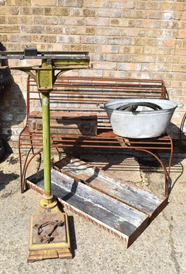 Lot 299 - A metal garden bench together with two pig...