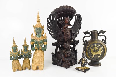 Lot 138 - A group of oriental carvings and sculptures,...