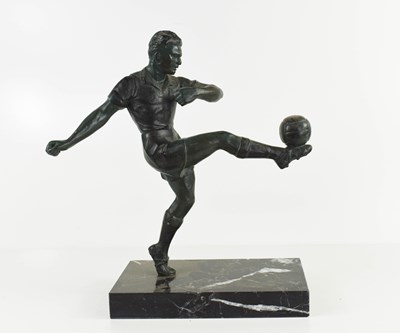 Lot 60 - A spelter figure of a footballer on black...