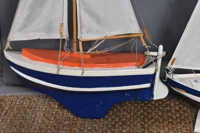 Lot 223 - Two hand built pond yachts, painted and rigged,...