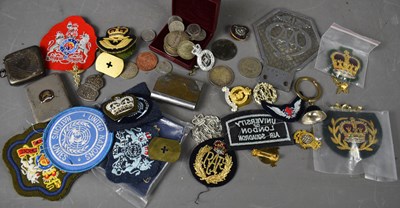 Lot 168 - A group of cap and uniform badges, including...