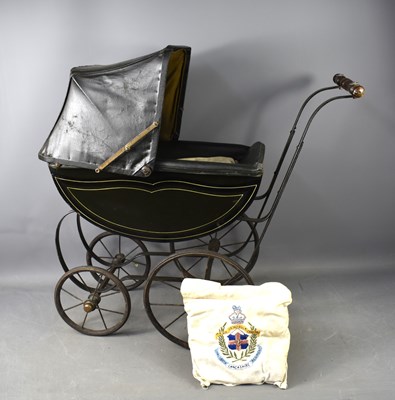 Lot 199 - A Victorian doll's pram, in black livery with...