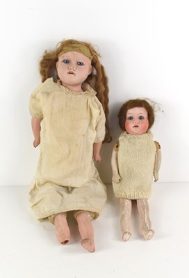 Lot 198 - A 19th century doll, likely german with sleepy...