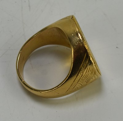 Lot 48 - An 18ct gold ring set with a Queen Victoria...