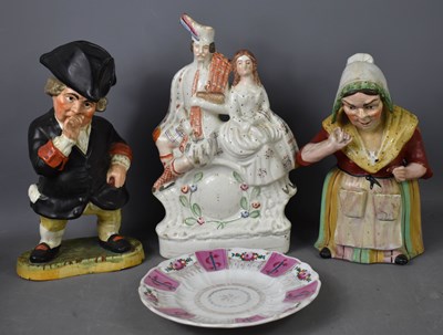 Lot 100 - A Victorian Staffordshire figure group,...