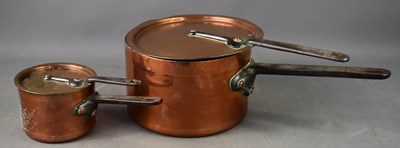 Lot 295 - Two Victorian copper pans with covers, with...