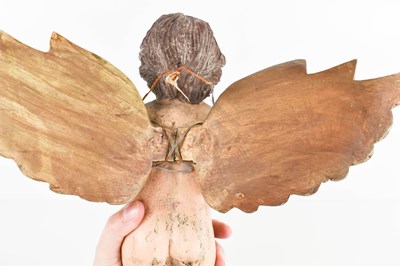 Lot 30 - A 20th century polychrome winged cherub, 29cm...
