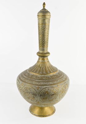 Lot 141 - A 19th century Indian brass bottle of flared...