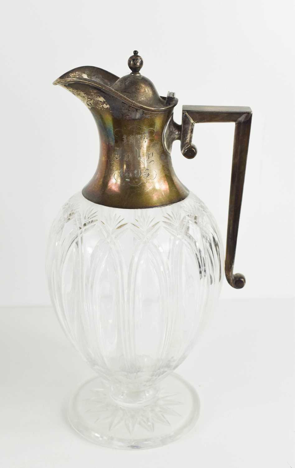 Lot 42 - A silver topped claret jug of baluster form...