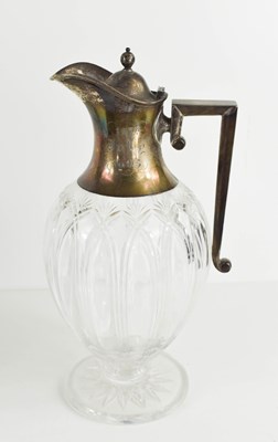 Lot 42 - A silver topped claret jug of baluster form...