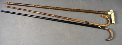 Lot 209a - Three vintage walking canes to include one...